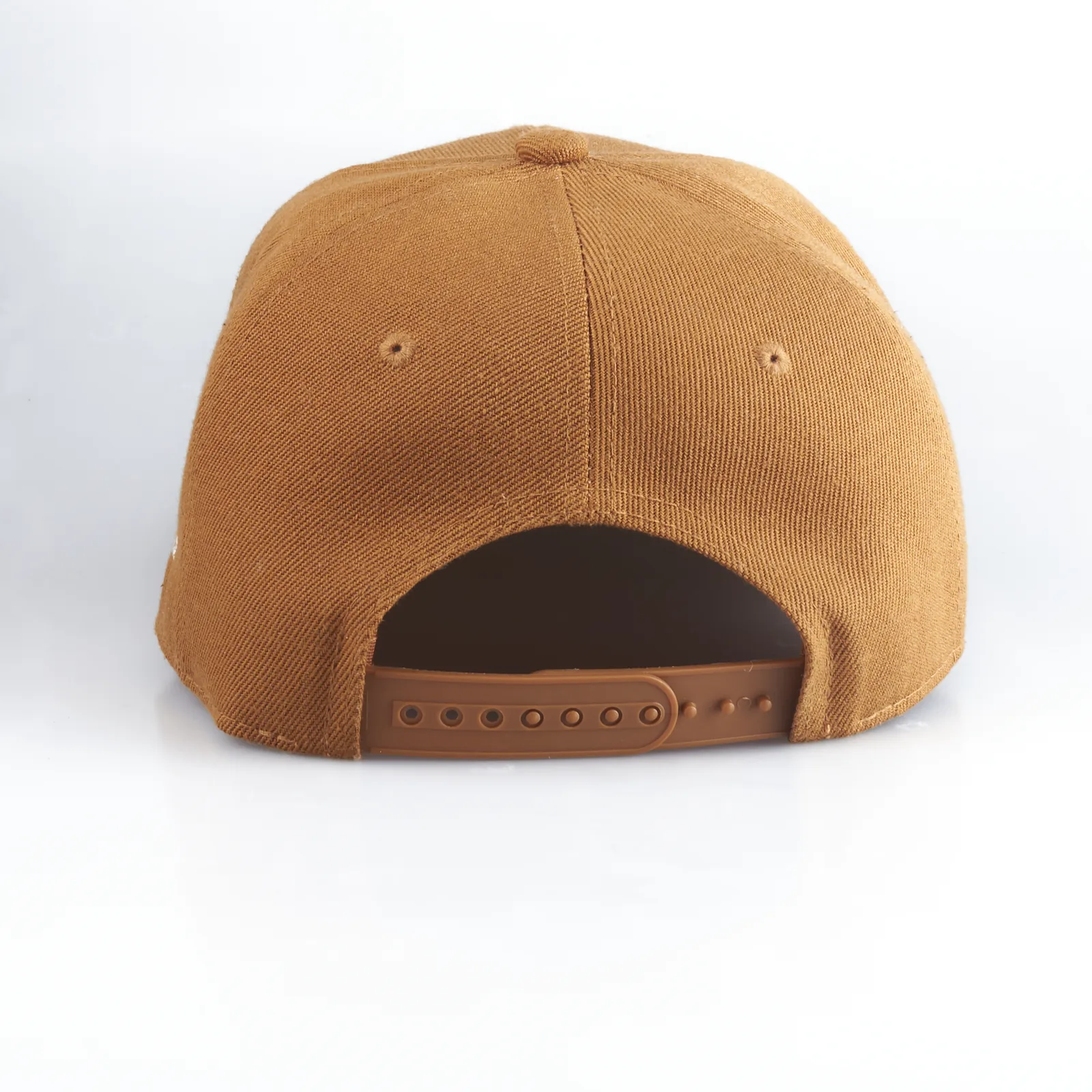 Studio product shot of a tan baseball cap, back view