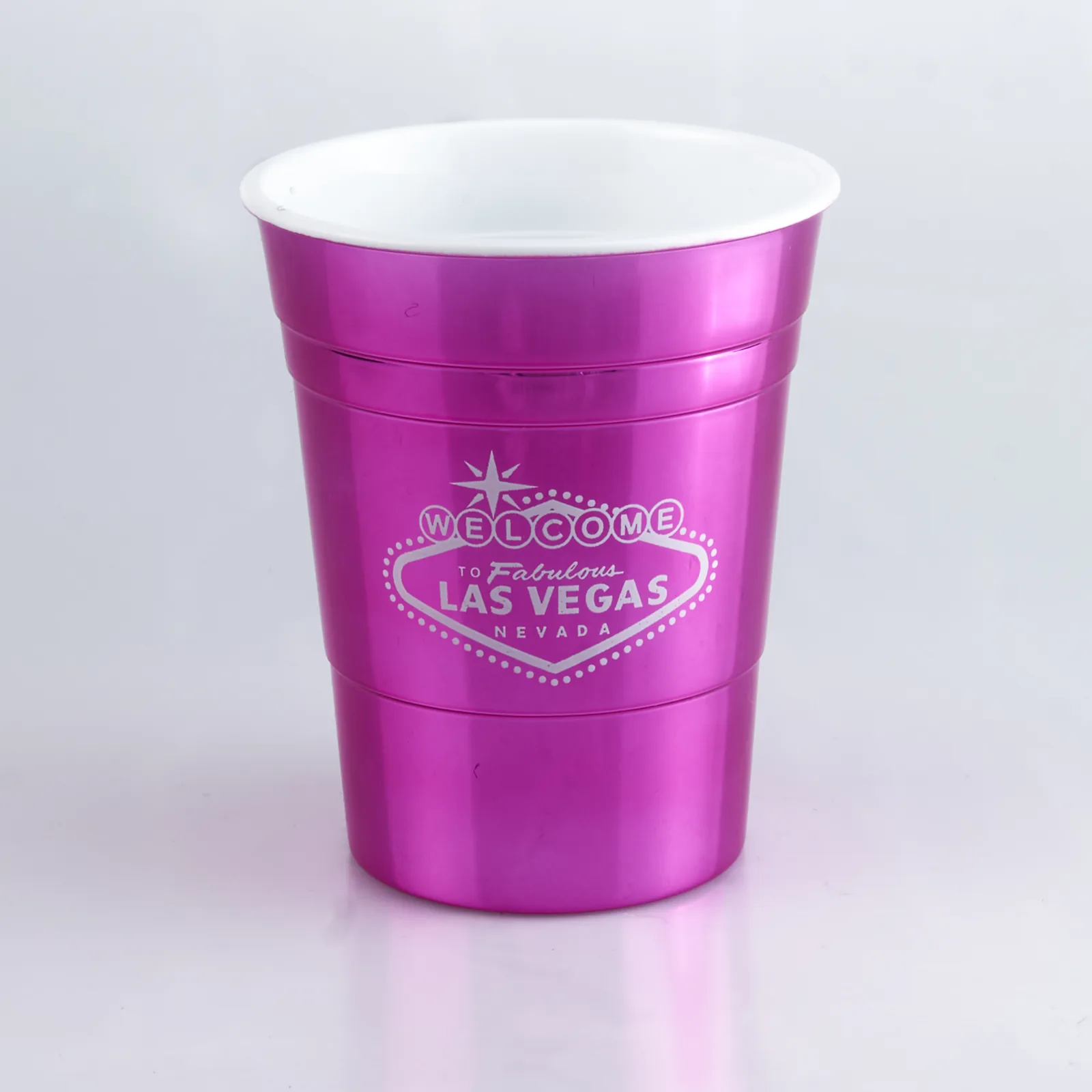 Studio product shot of a metallic pink party cup