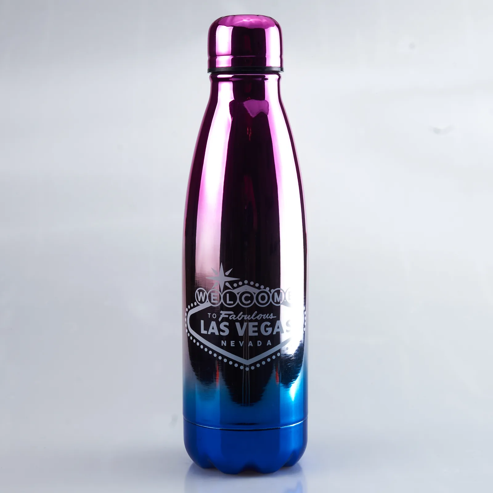 Studio product shot of an iridescent steel water bottle