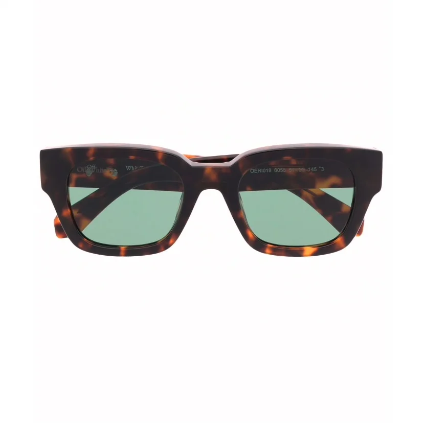 Studio product shot of tortoise-shell sunglasses on white