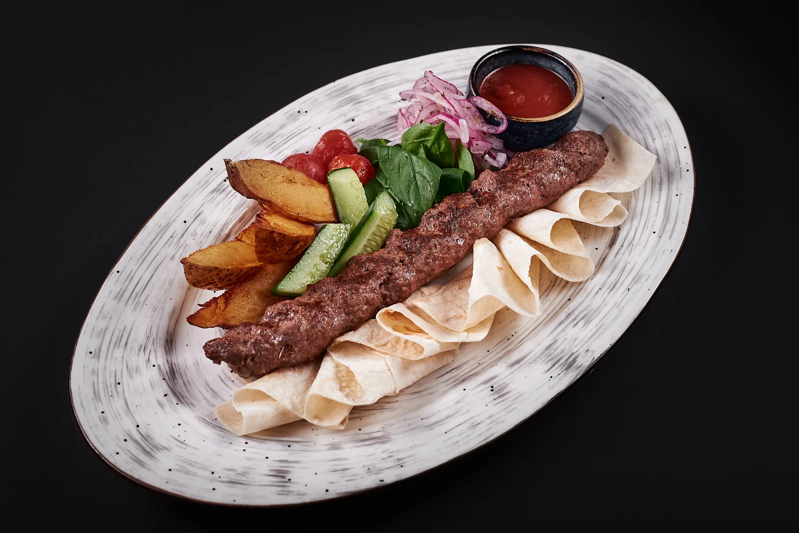 Kebab plate with grilled vegetables shot from above