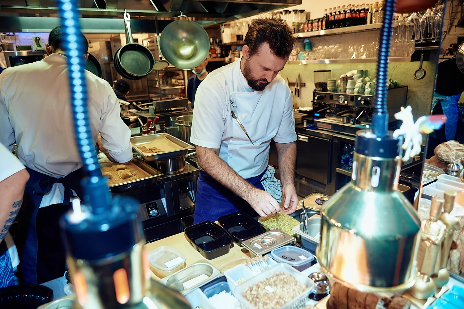 Chef plating dishes in a restaurant kitchen