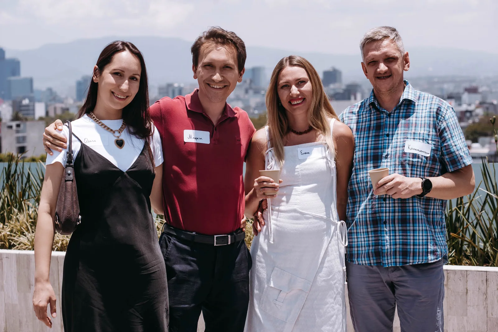 Group of attendees posing together at a business forum