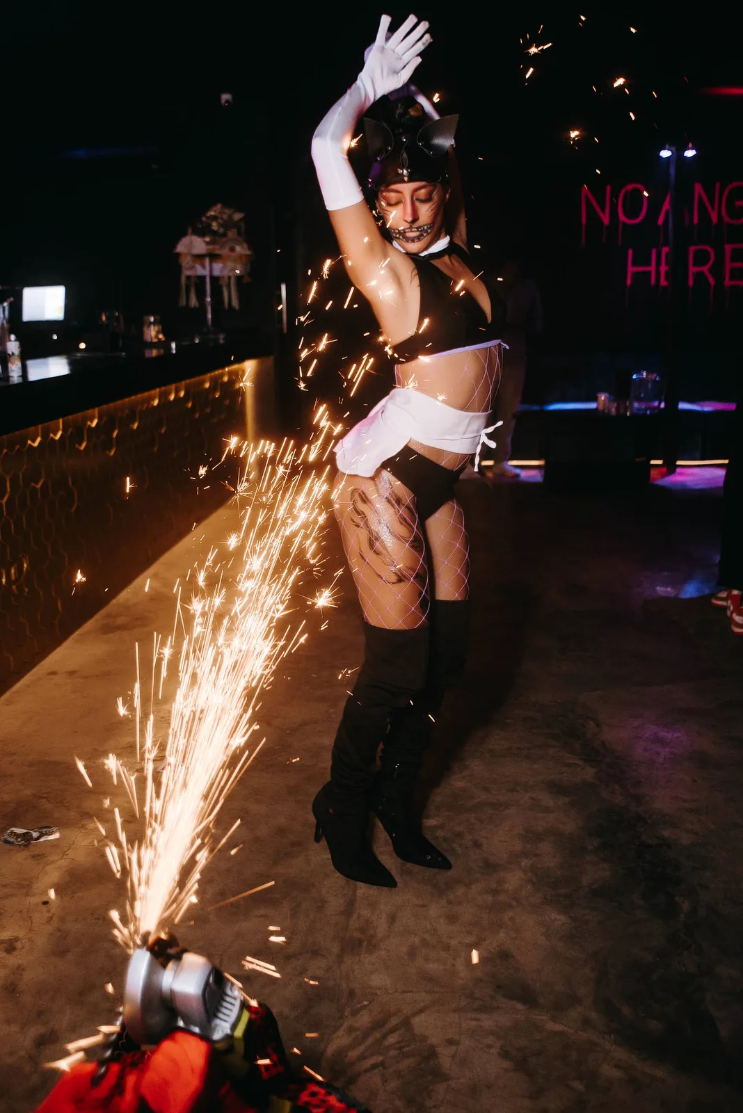Performer with sparklers at a birthday party in a club