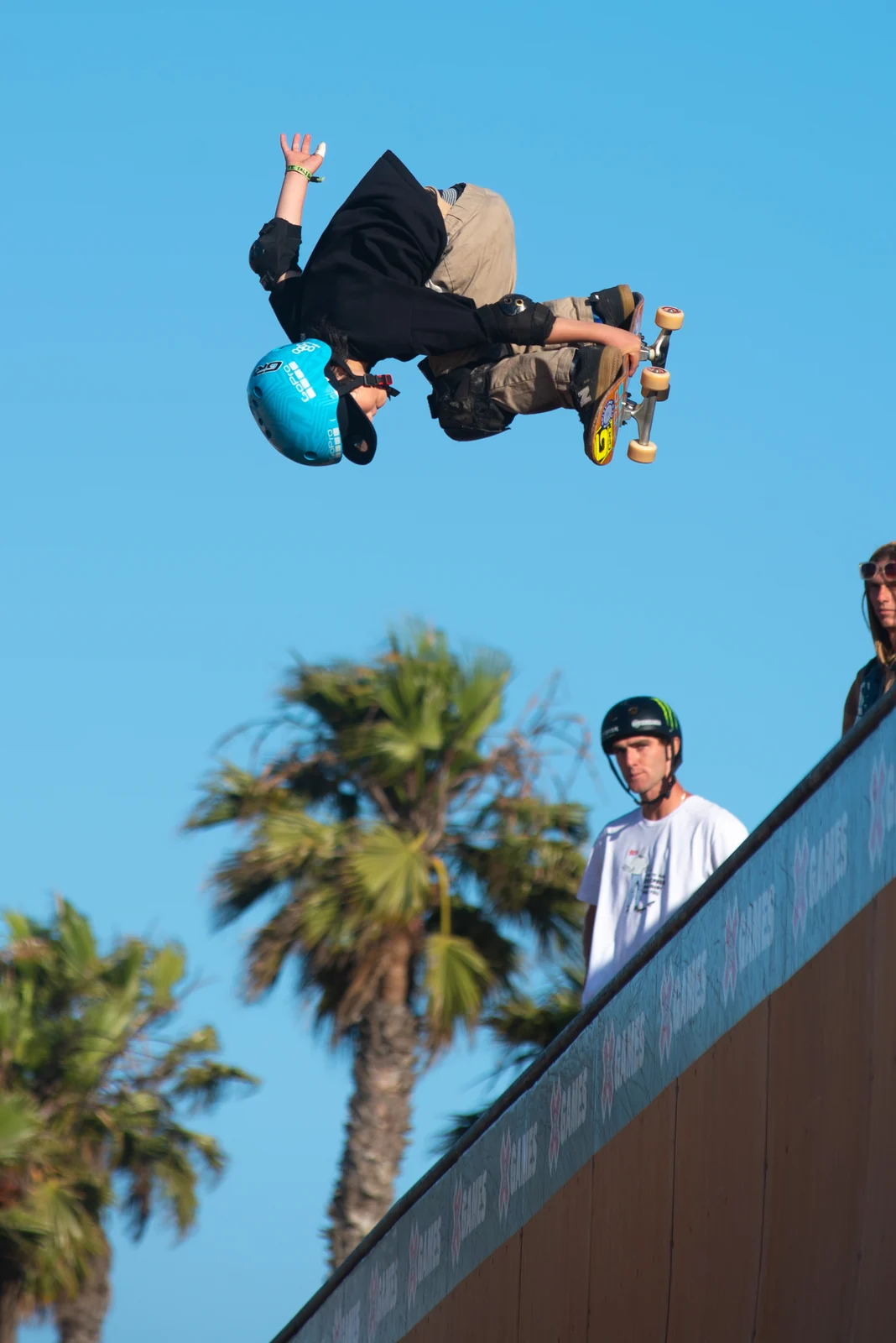 Skater mid-air above the ramp crowd