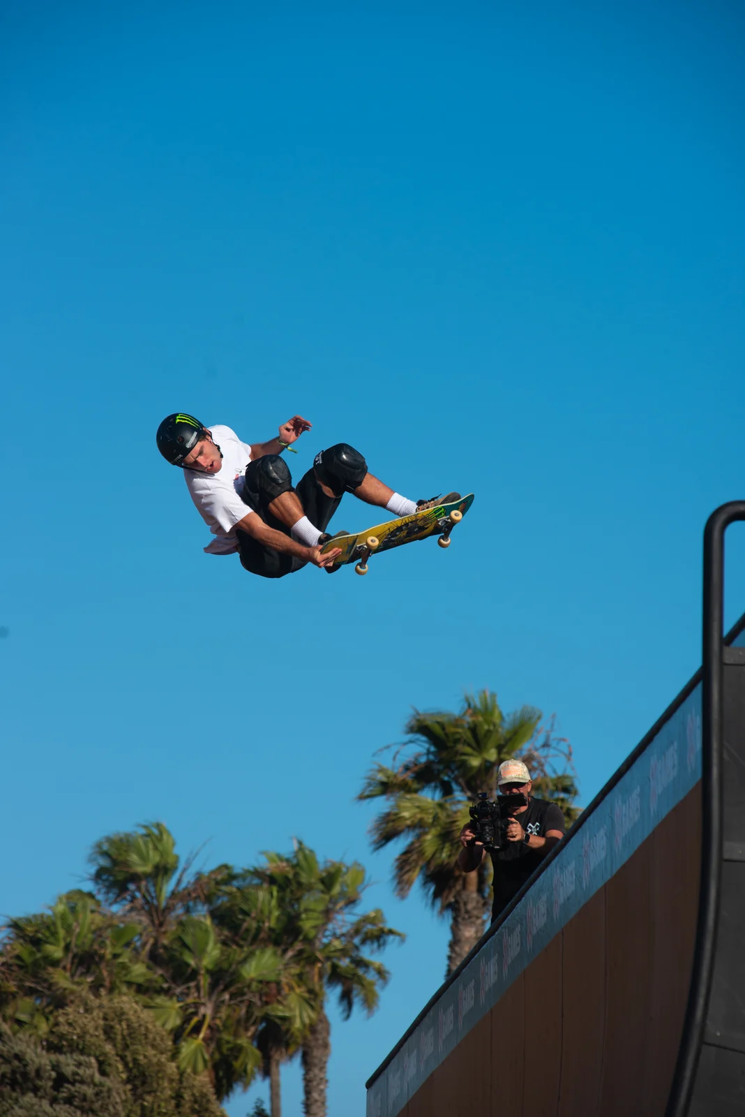Vert skater upside down in the sky