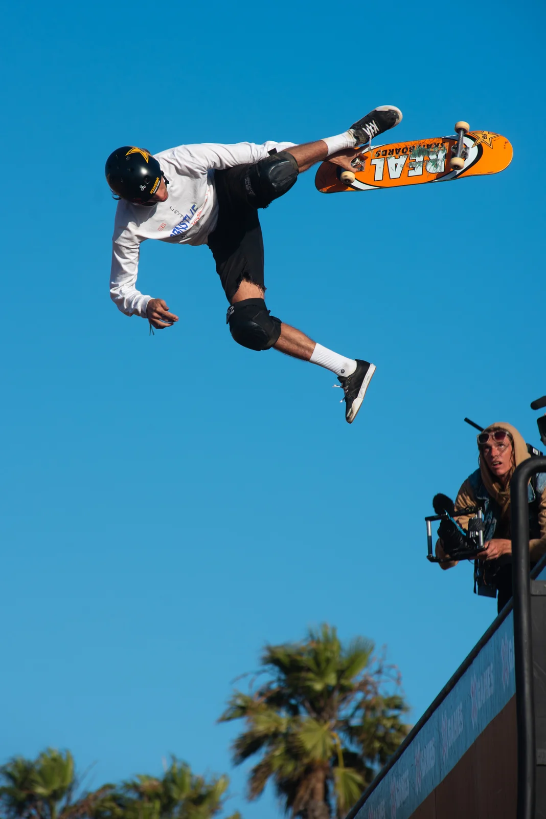 Skater grabbing the board in mid-air