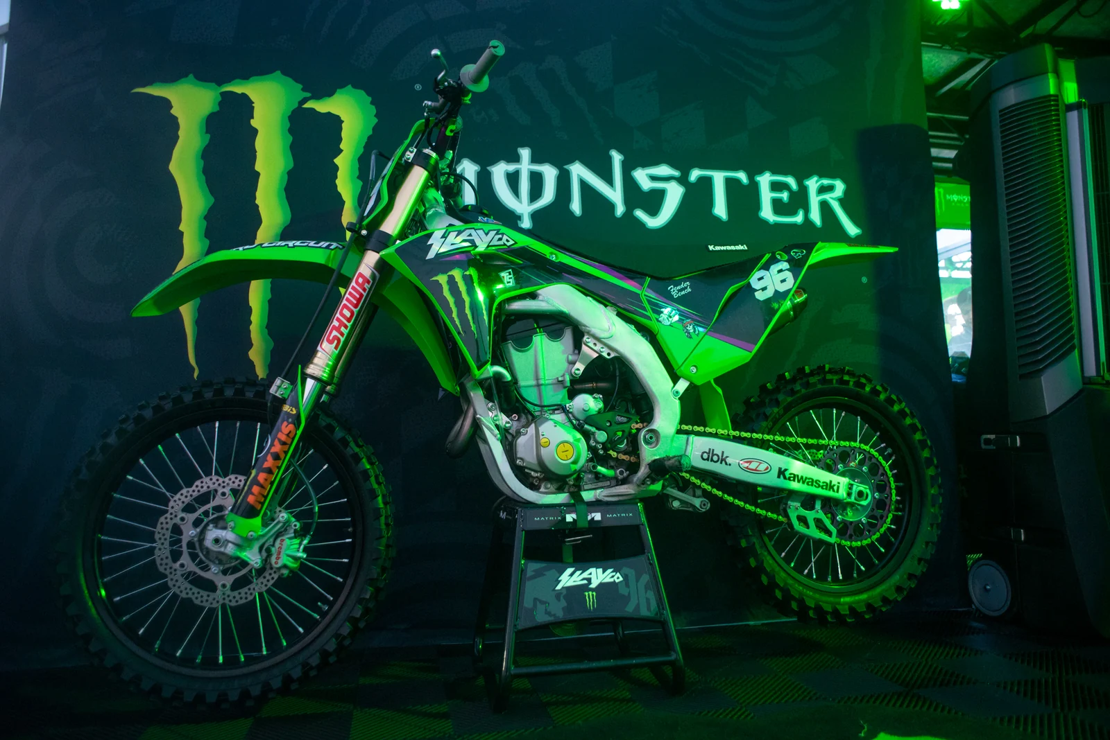 Moto X bike under green light at night
