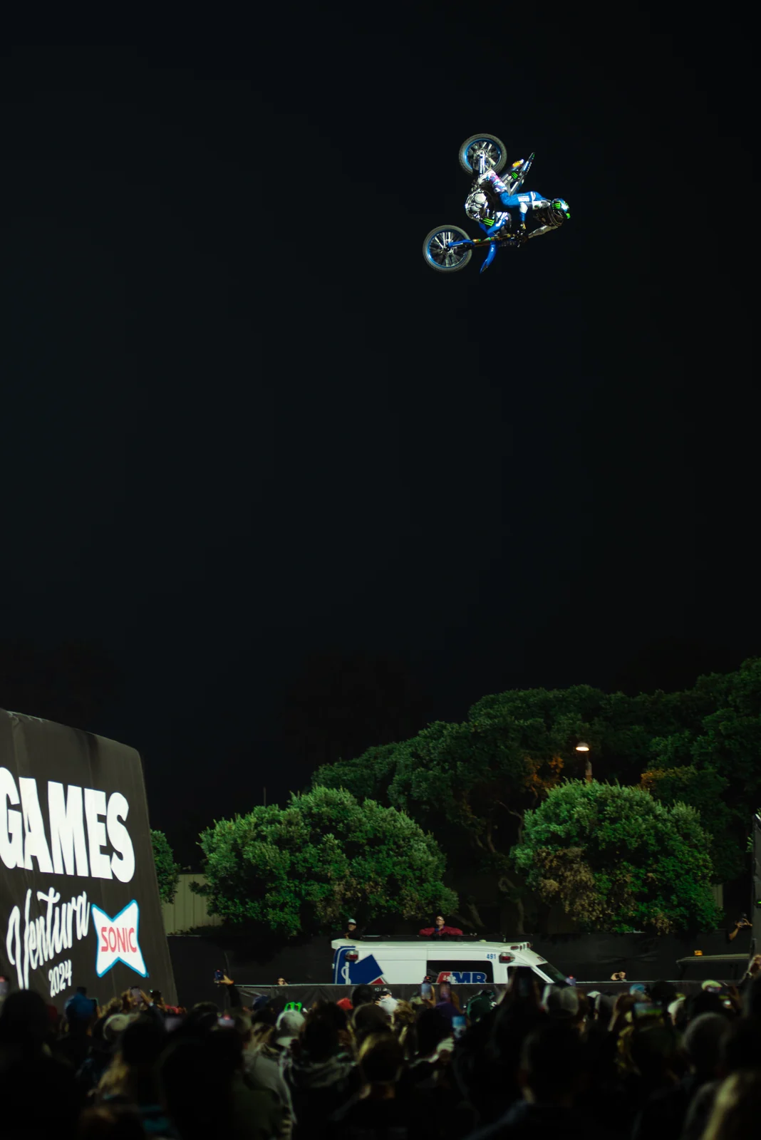 Night Moto X jump above the crowd
