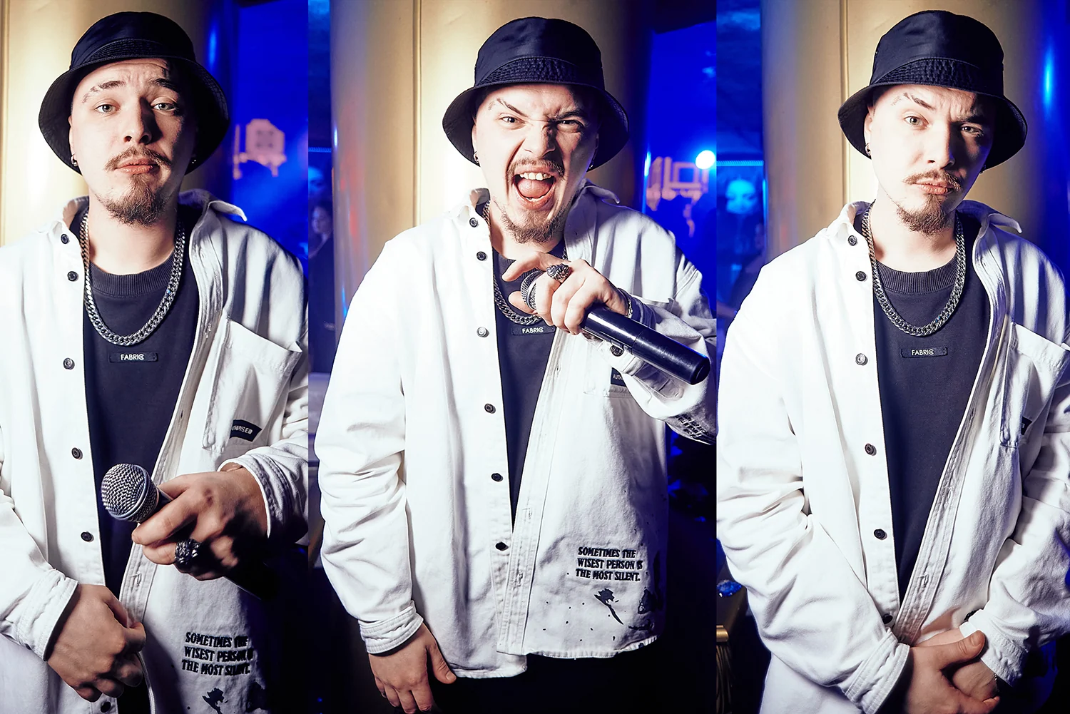 Rapper in a white jacket with a microphone on stage