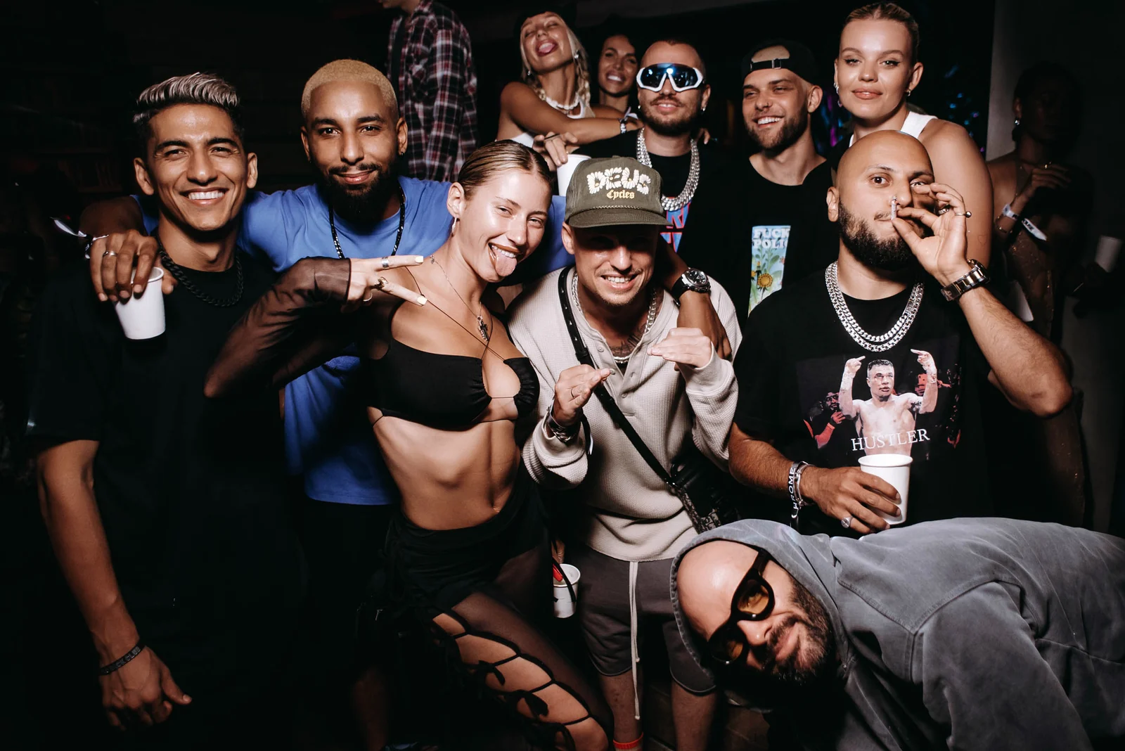Group of friends posing at a club table