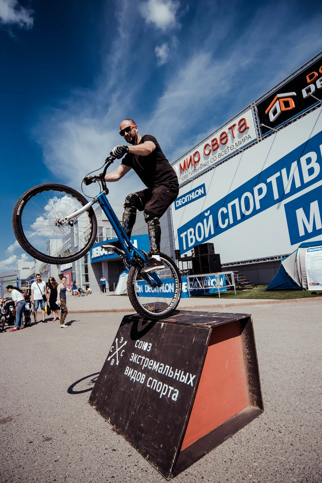 BMX rider jumping over a box