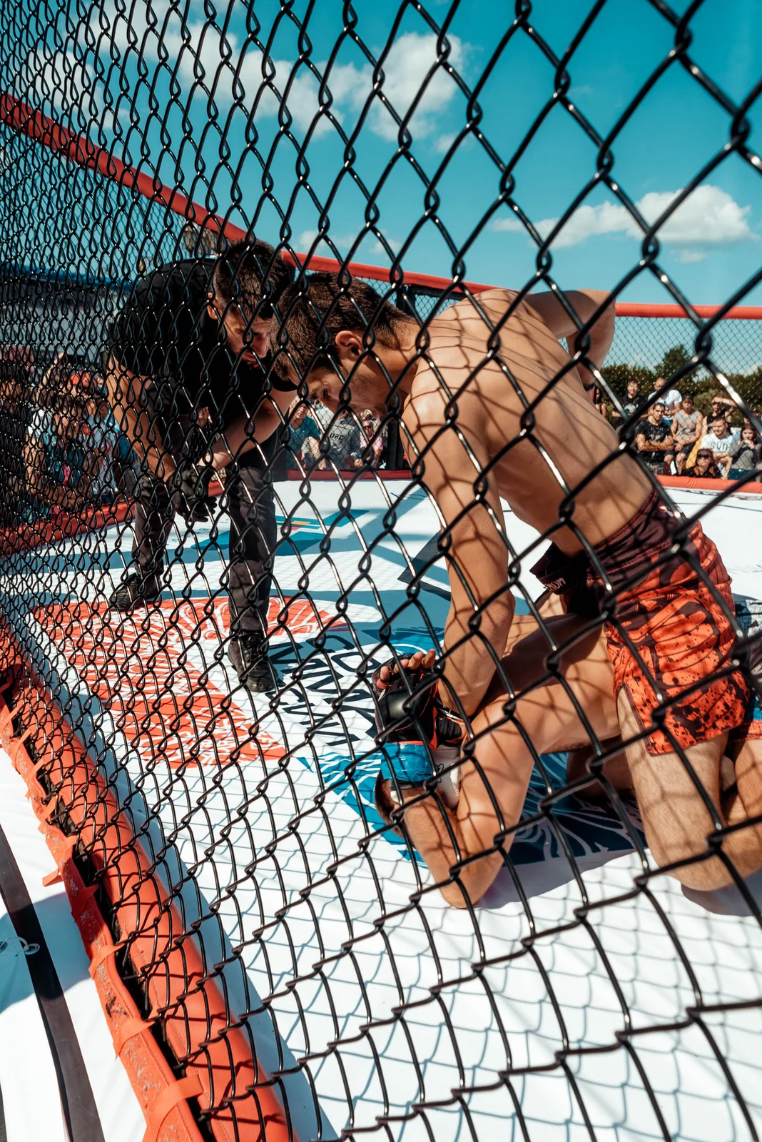 Fighters through the cage net