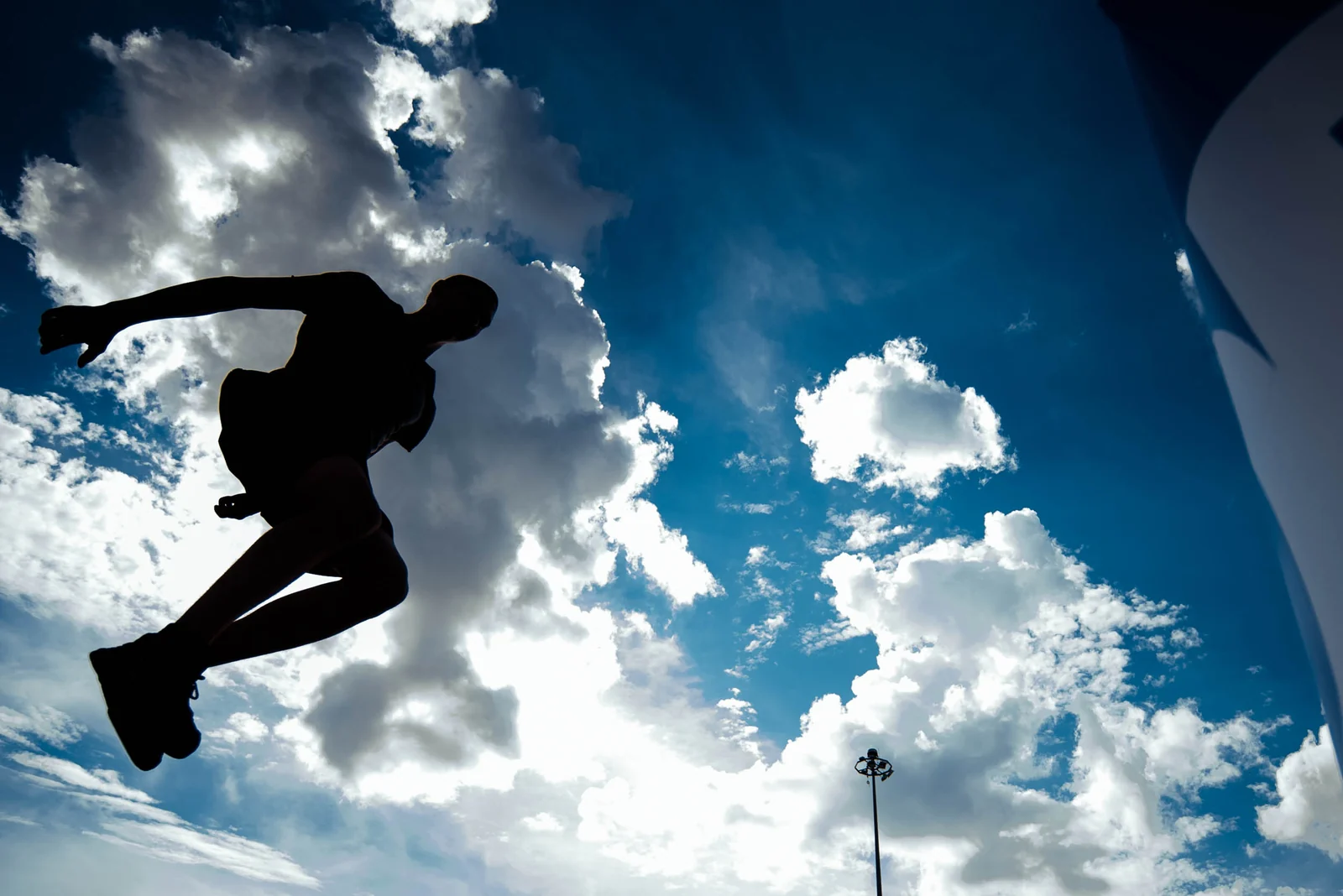 Parkour silhouette against the sky