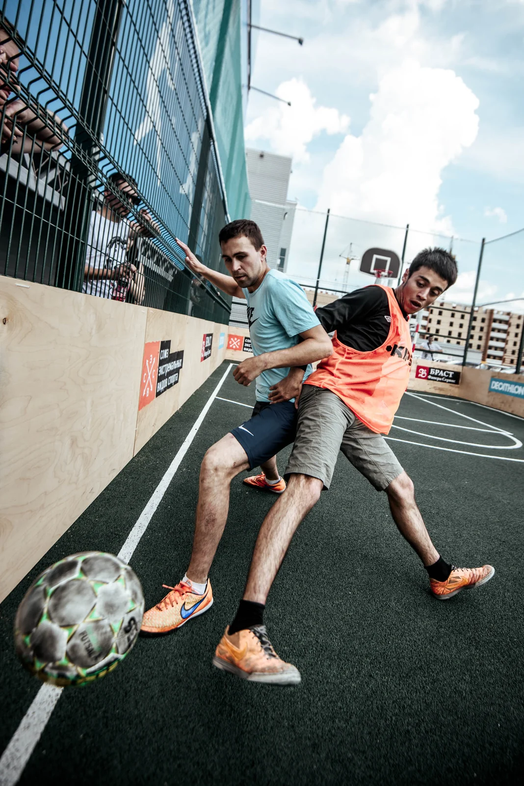 Street football duel at the cage pitch